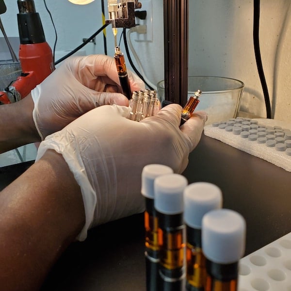 Karing Kind Labs personnel preparing product