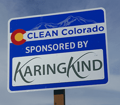 Highway sign showing Karing Kind as the sponsor